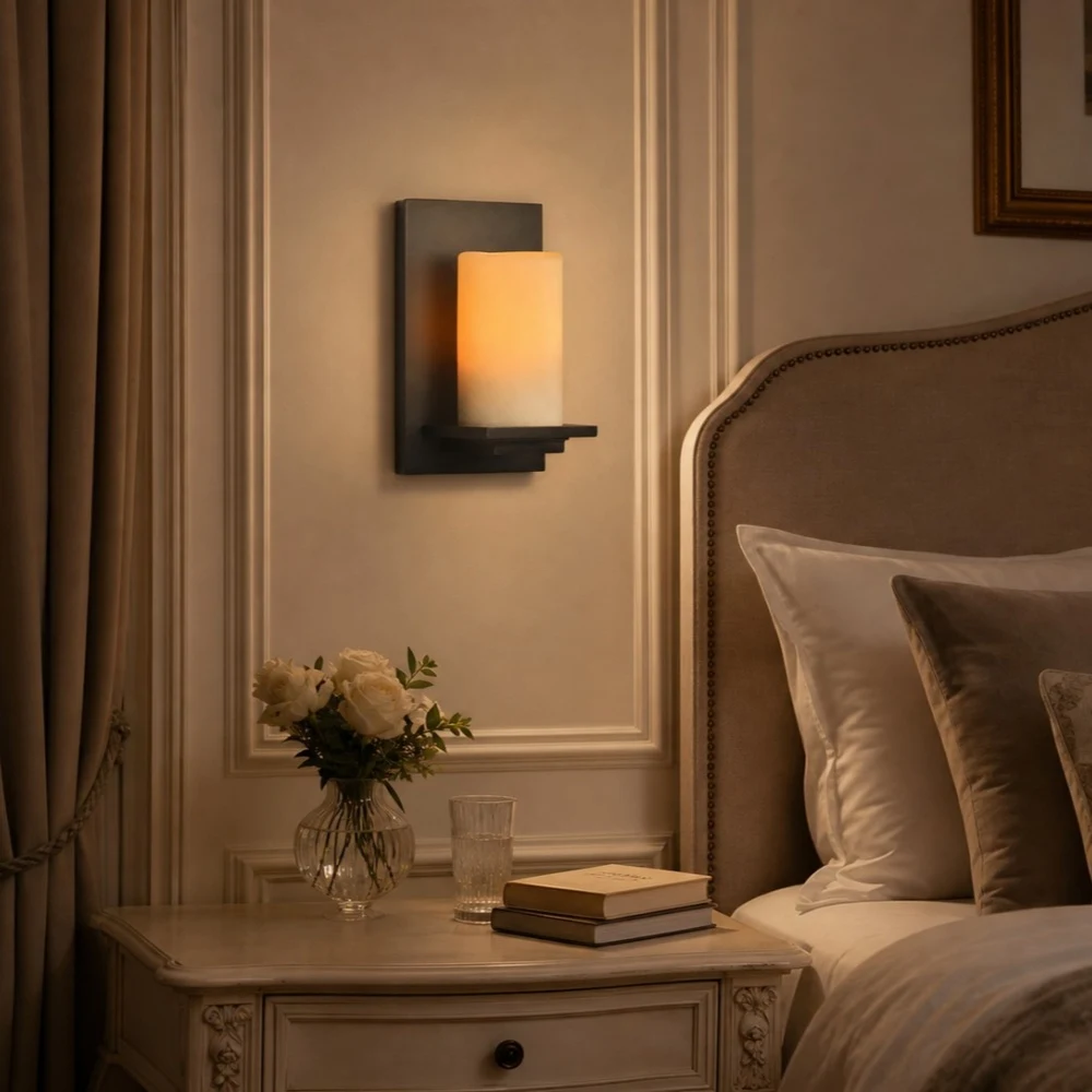 Jade wall lamp beside upholstered bed