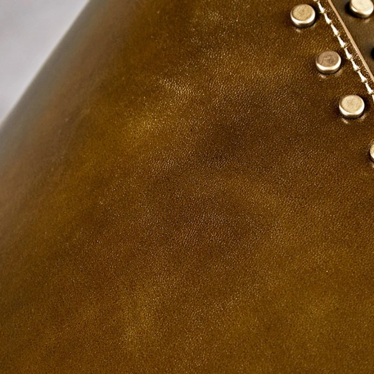 Close detail of brown leather shade texture and stitched edge