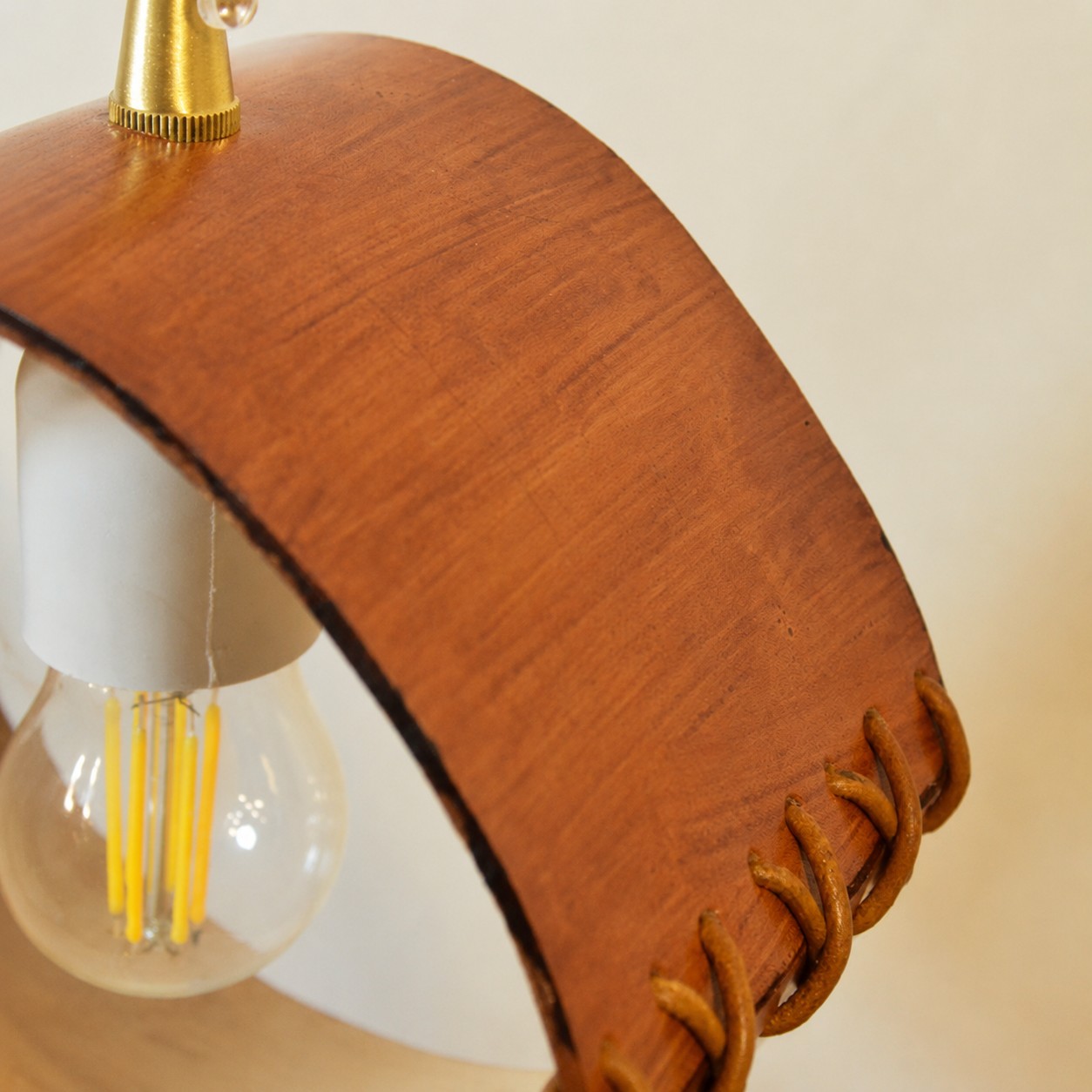 Leather grain and pendant hardware close-up