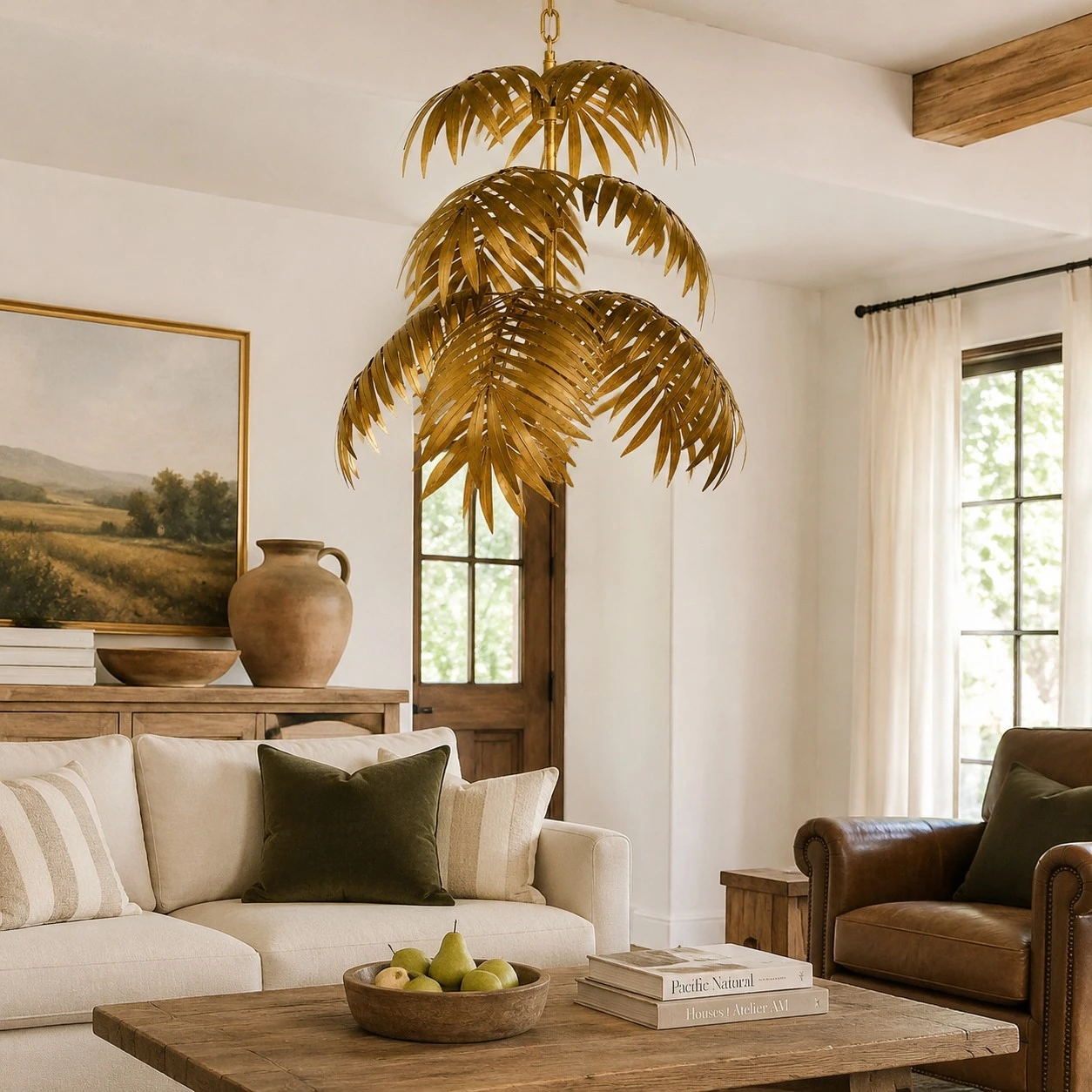 Gold palm leaf chandelier in a warm living room