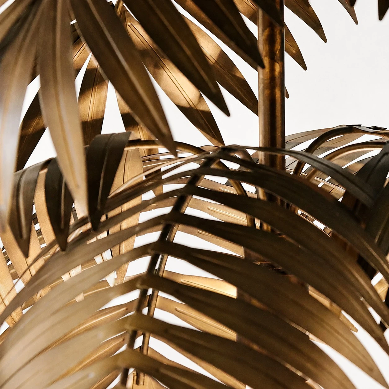 Close view of layered forged iron leaves on the chandelier