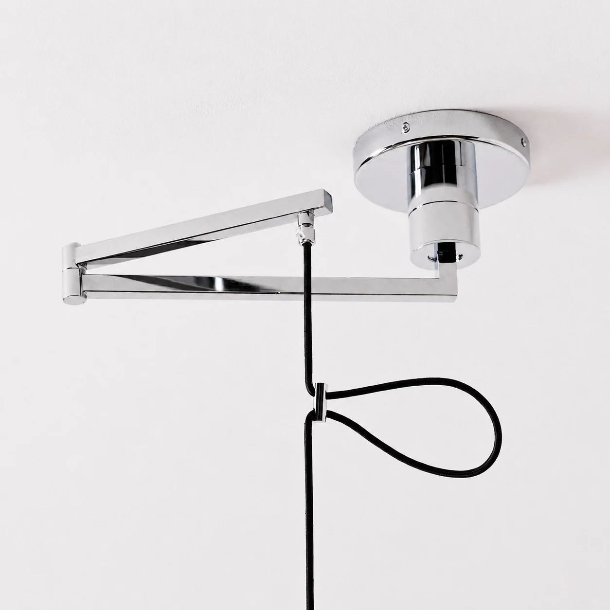 Adjustable arm, ceiling canopy, and hanging cable detail